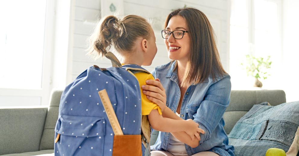 Woman smiling and talking to a child about their ex not following a parenting agreement.